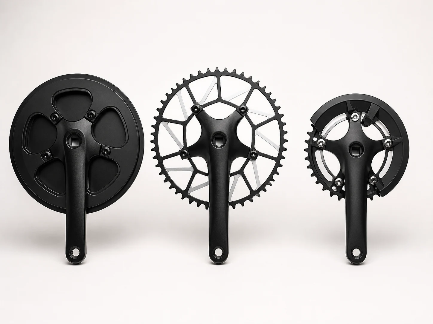 Unbranded city and single-speed bicycle crankset family on a neutral studio background